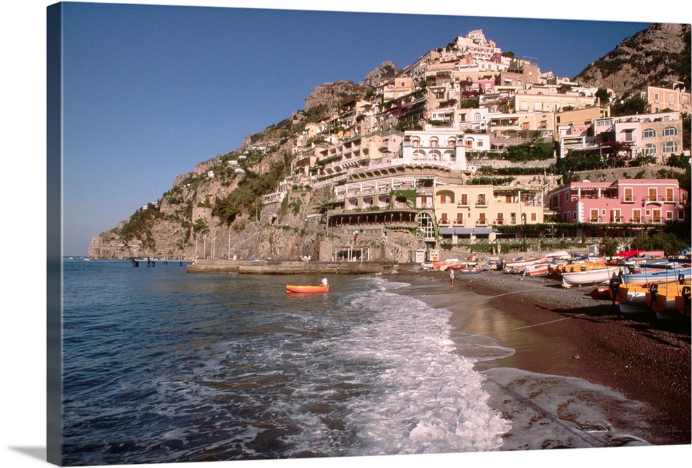 The hillside buildings overlook the beach at Positano in Campania, Italy.