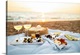 image thumbnail of Beautiful served picnic at seaside on sunset. Romantic picnic for two with fruits, snacks, white wine and cheese pizza on ...