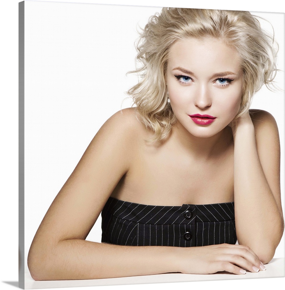 Beauty portrait of young blonde, professional hairstyle and make-up