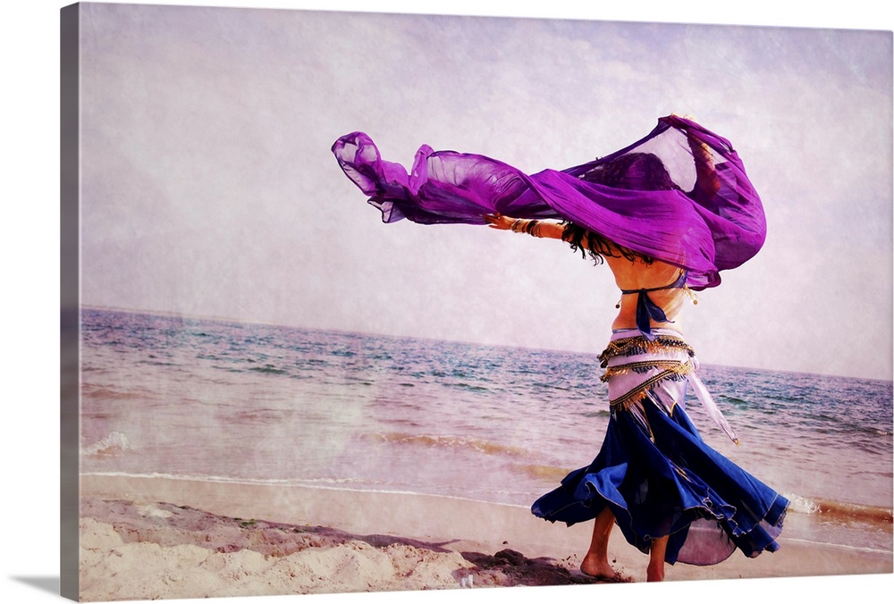 A beautiful belly dancer, dancing on the Coney Island  Beach, New York.
