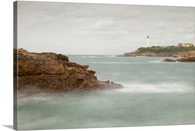 Biarritz Lighthouse with rocks and sea.