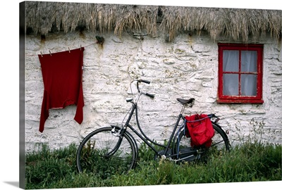 Bike in front of cottage, Isle of Man