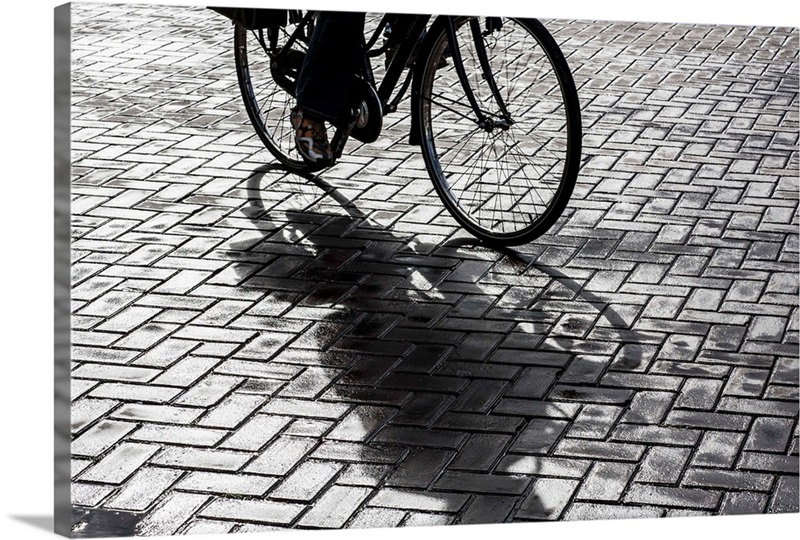 Bike rider on streets of Amsterdam | Great Big Canvas