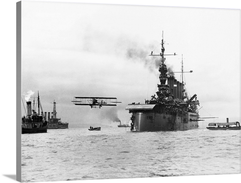 Civilian pilot Eugene Ely guides his biplane from the deck of the United States Navy armored cruiser Pennsylvania anchored...