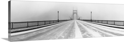 Black and white panorama of St. Johns Bridge in Portland, Oregon in winter snow storm.