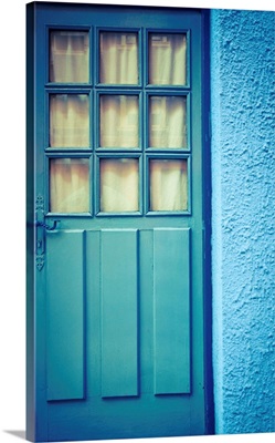 Blue door with blue wall.