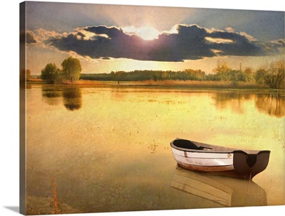 Boat in lake at sunset.