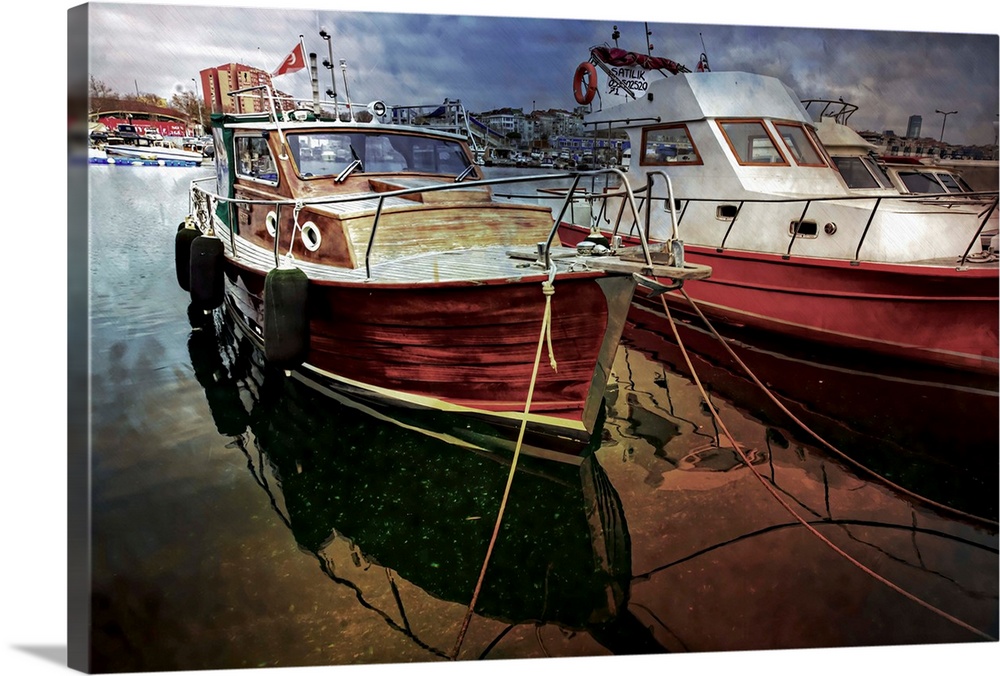 Old fishing boats tied up in a small boatyard in Istanbul.