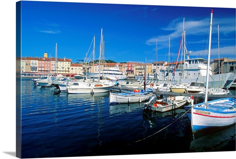 Boats anchored at a harbor, Saint Tropez, French Riviera, France Wall ...