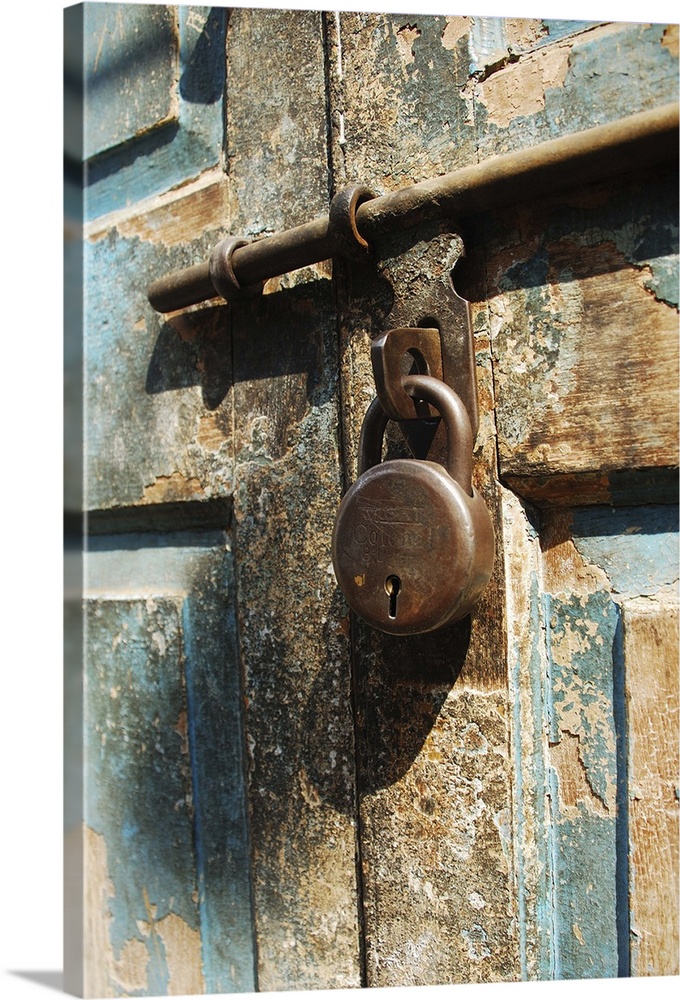 Locked door in Bombay's Matunga locality. Blue paint peeling off, and rusty lock make for good textures.