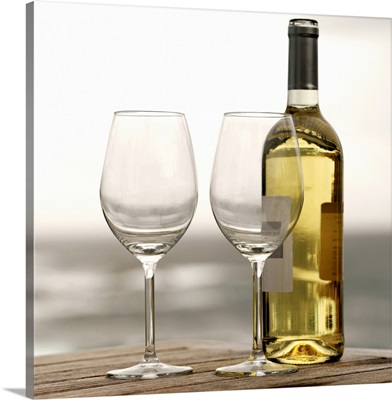 bottle of white wine and two glasses