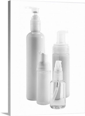 Bottles of skin care products on white background
