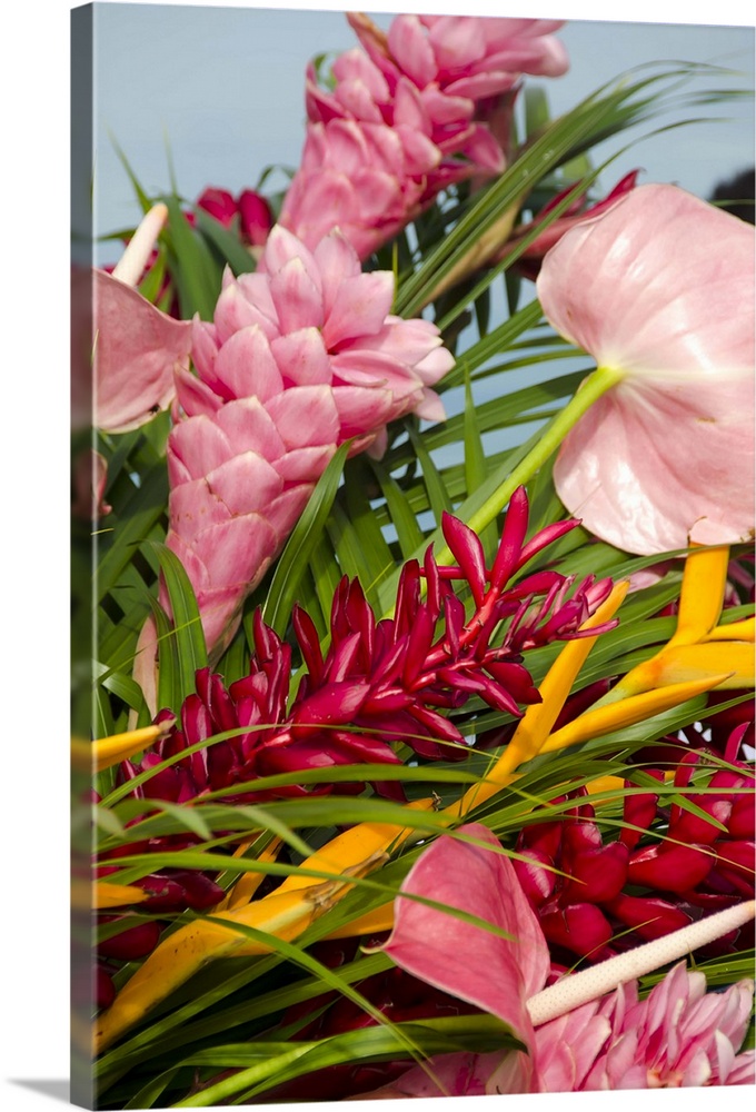 Bouquet of tropical flowers including red ginger, pink ginger, pink anthurium and yellow lobster claw.