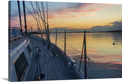 Bow of 62 ft sailboat at sunset