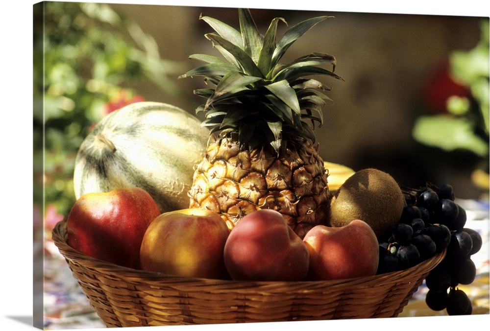 bowl of summer fruit, pineapple melon, peach, grapes, kiwi ...