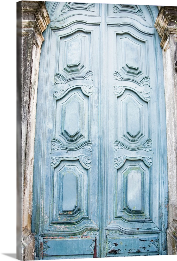 Vertical photo print of a tall antique door.