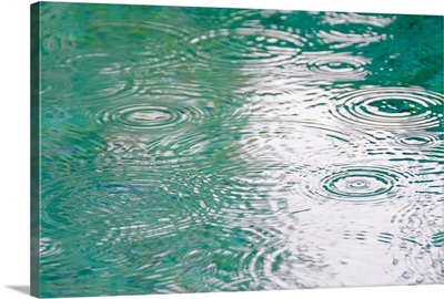 Brazil, Bahia, Trancoso, Raindrops on falling on pond surface