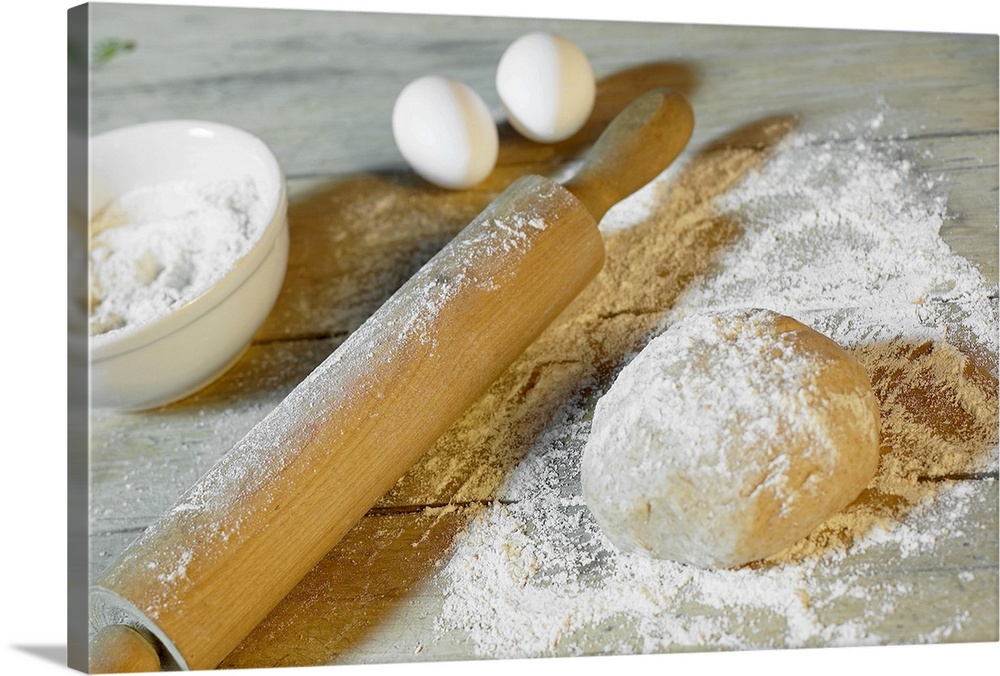 Docor perfect for the home or kitchen of a ball of dough that has been dusted with flour with a rolling pin, eggs and the ...