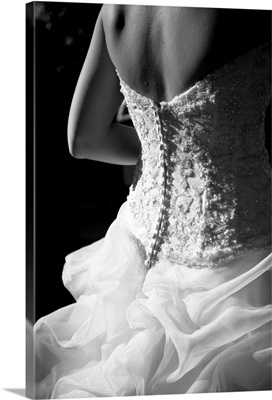 Bride wearing white wedding dress.