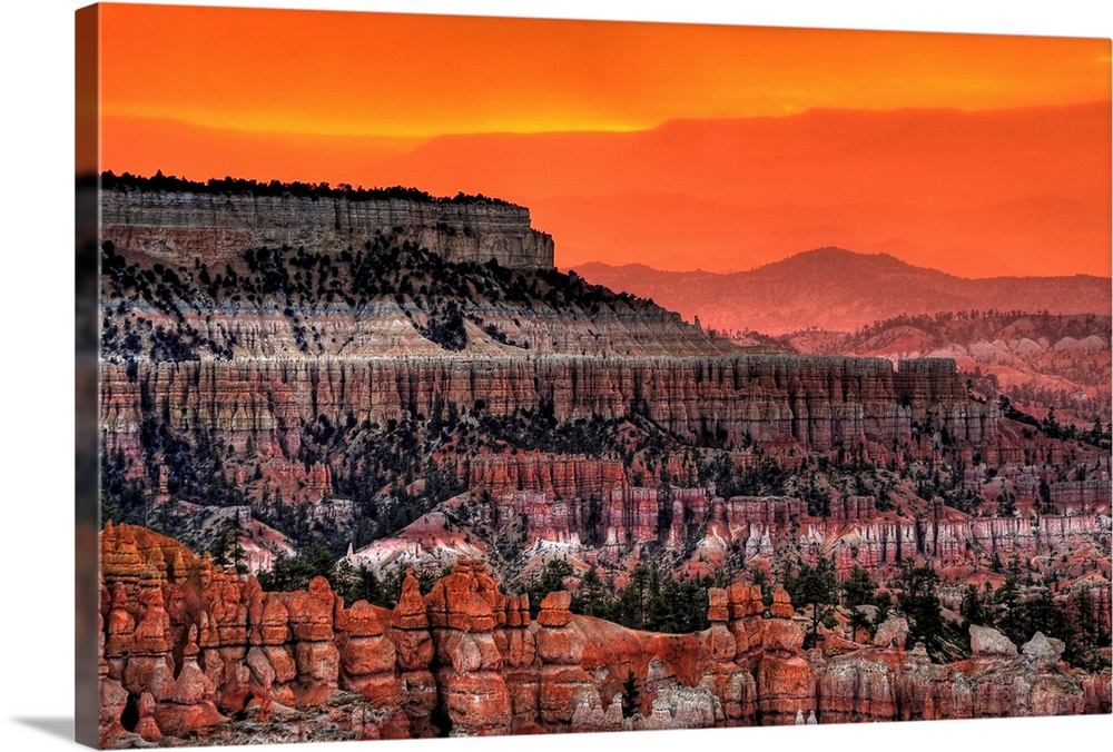Bryce Canyon taken at sunrise. The pictures shows the characteristic hoodoos and rock formations across the valley.