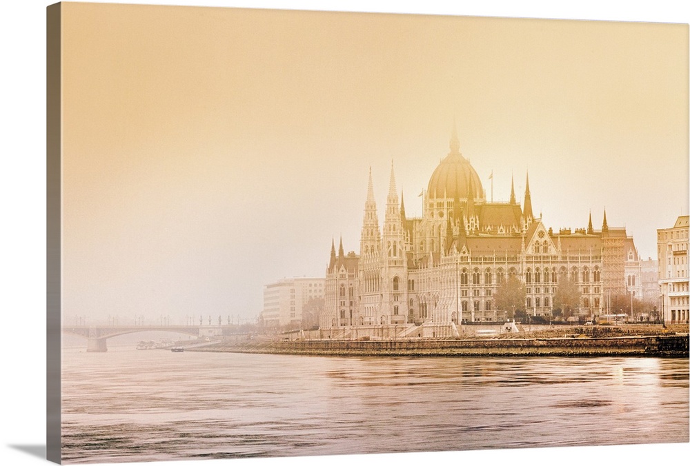 Atmospheric winter conditions surround the Hungarian Parliament Building on the banks of the Danube in Budapest.