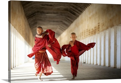Buddhism Novices Are Walking With Umberella In Temple
