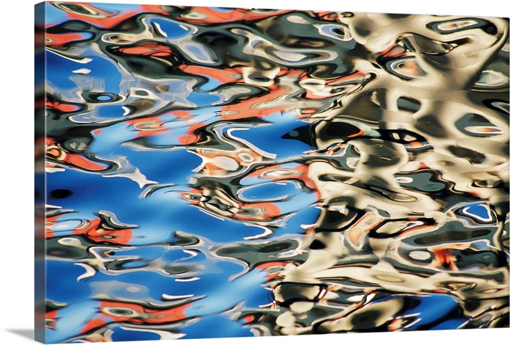 Buildings reflected in water, full frame