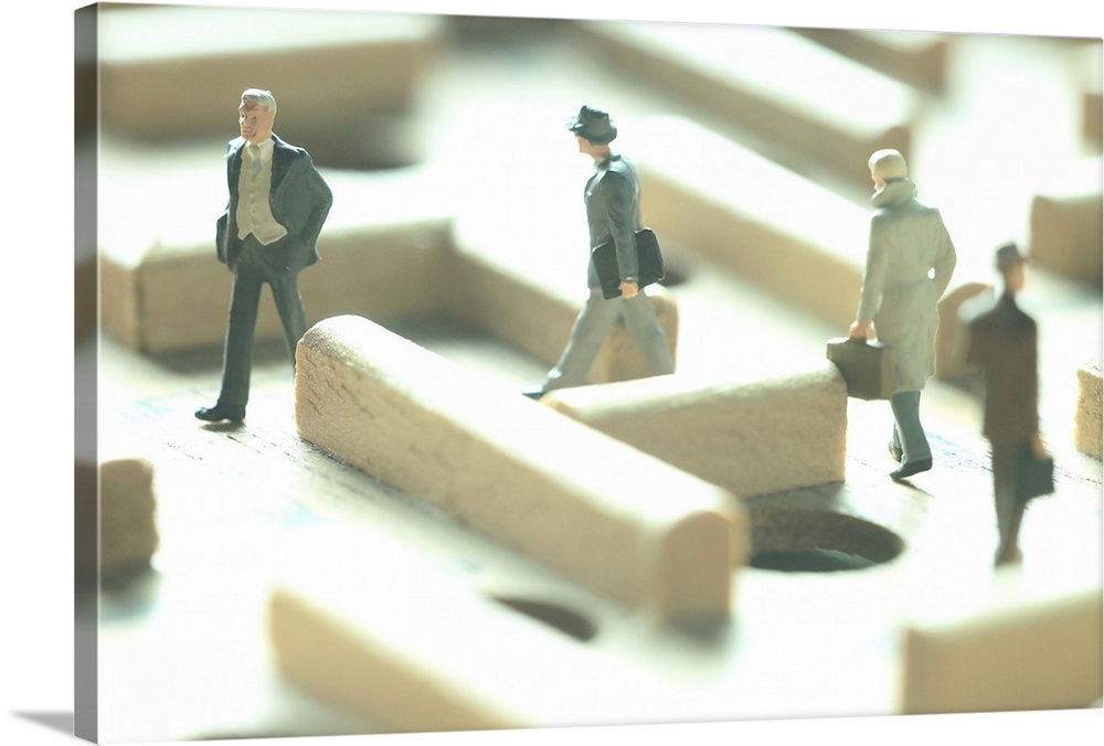 Businessmen figurines in a maze game