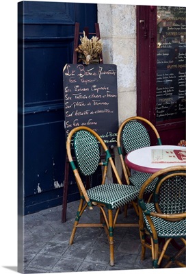 Cafe table with cane chairs in Paris, France