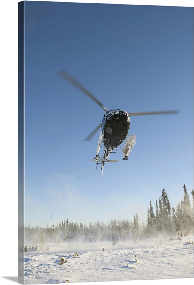 Canada, Alberta, Helicopter landing on snow
