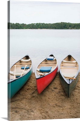 Canoes at lake shore