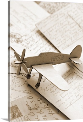 Cardboard airplane on postcards