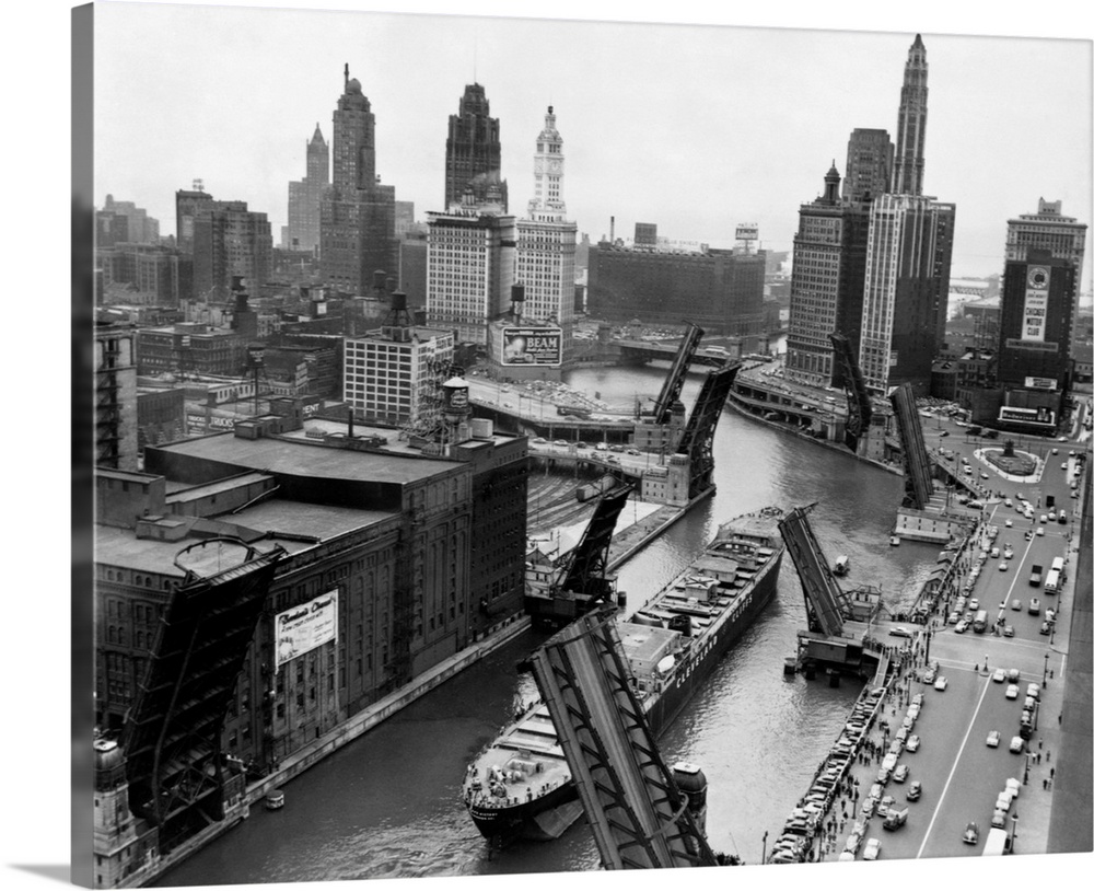 The cargo ship Cliff's Victory is towed through Chicago on the Chicago River.