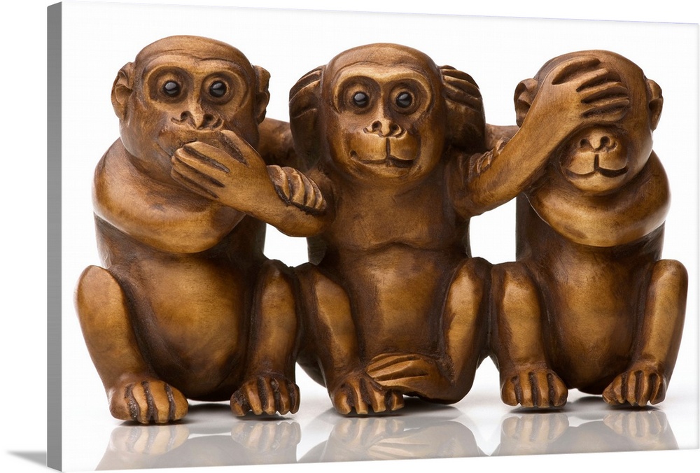 Carving of three wooden monkeys