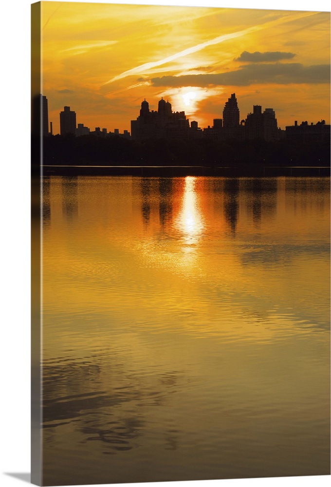 The silhouette of Midtown and Central Park West buildings can be seen  on the horizon.