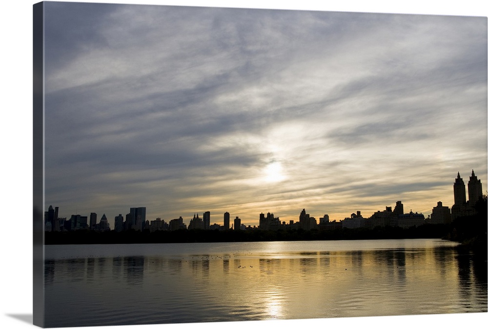 Silhouette of Midtown and Central Park West buildings, Manhattan, can be seen  behind.