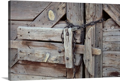 Chains And Lock On Weathered Barn Door
