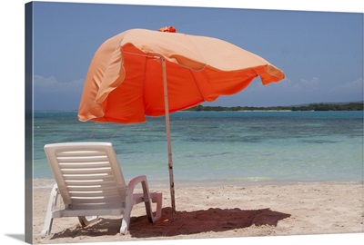 Chair with parasol umbrella on beach