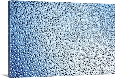 changing lightness of water drops on glass after rain