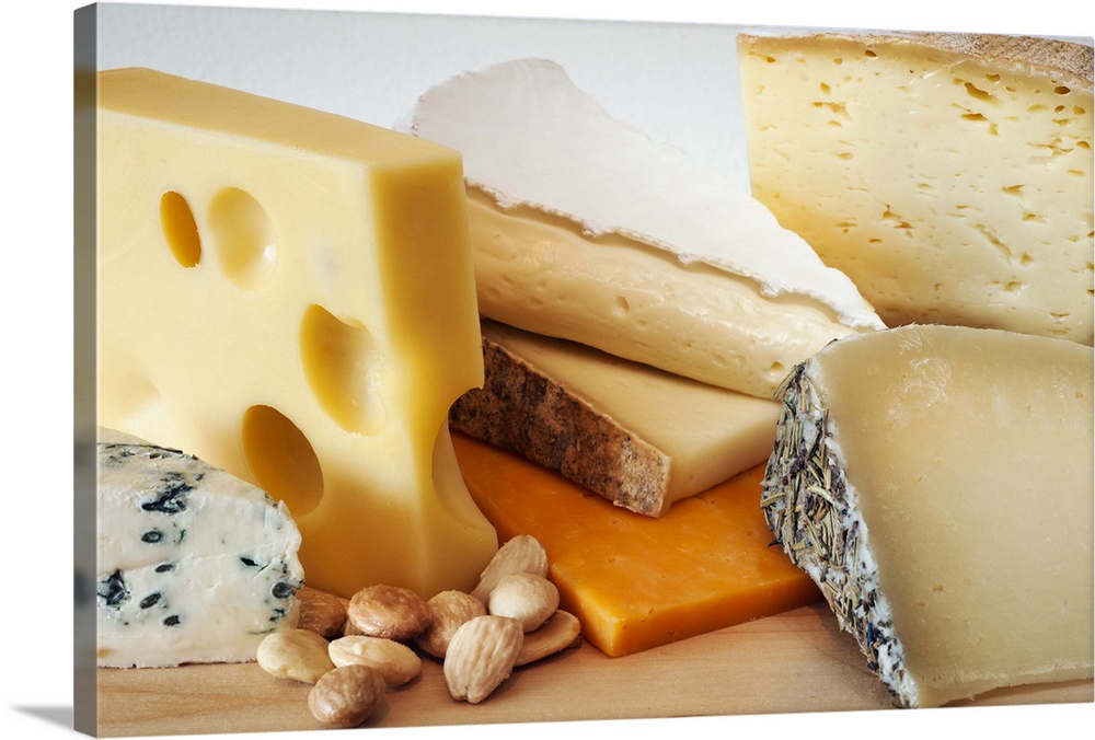 Various cheeses on chopping board