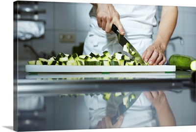 Chef chopping courgettes