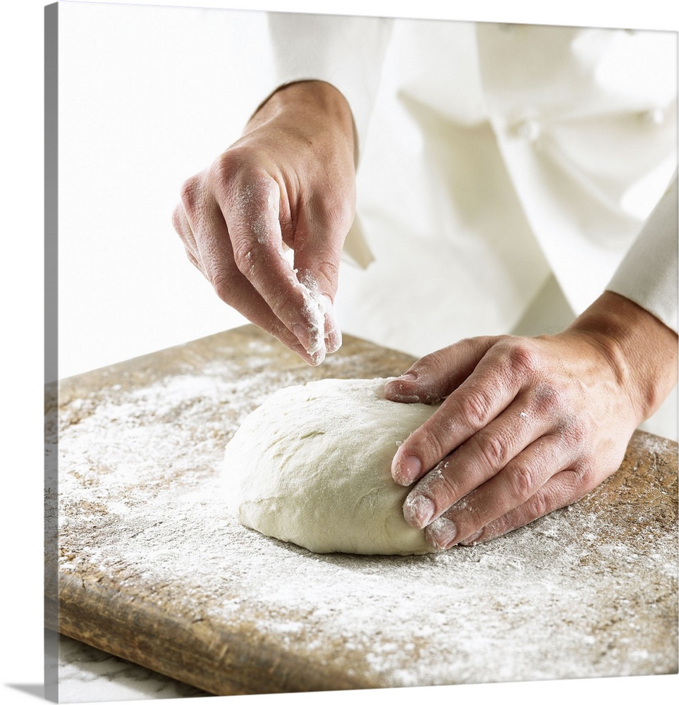 Chef rolling out dough