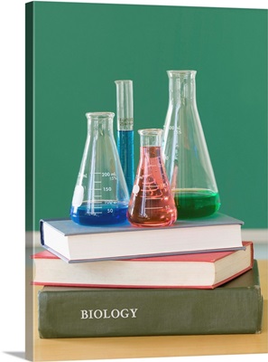 Chemistry beakers and stack of books
