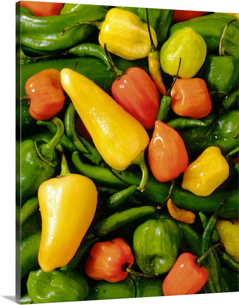 This vertical photograph of food is a pile of hot peppers.