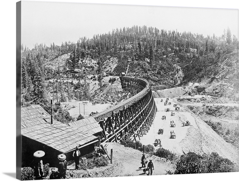 Chinese laborers at work with pick and shovel wheelbarrows and one horse dump carts filling in under the long secret town ...