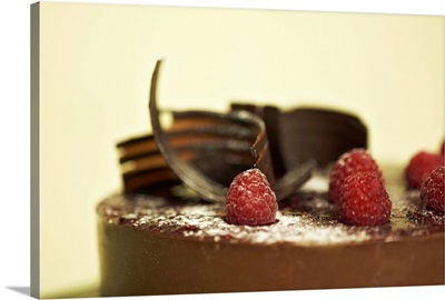 Chocolate ganache cake with raspberries and chocolate shavings