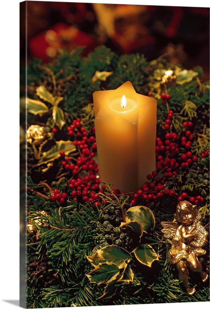Christmas candle with evergreen decorations