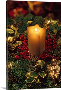 Christmas candle with evergreen decorations image thumbnail