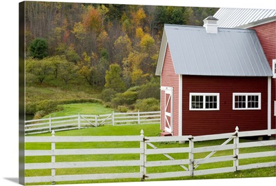 Classic New England farm with red barn and white fence, Vermont, USA
