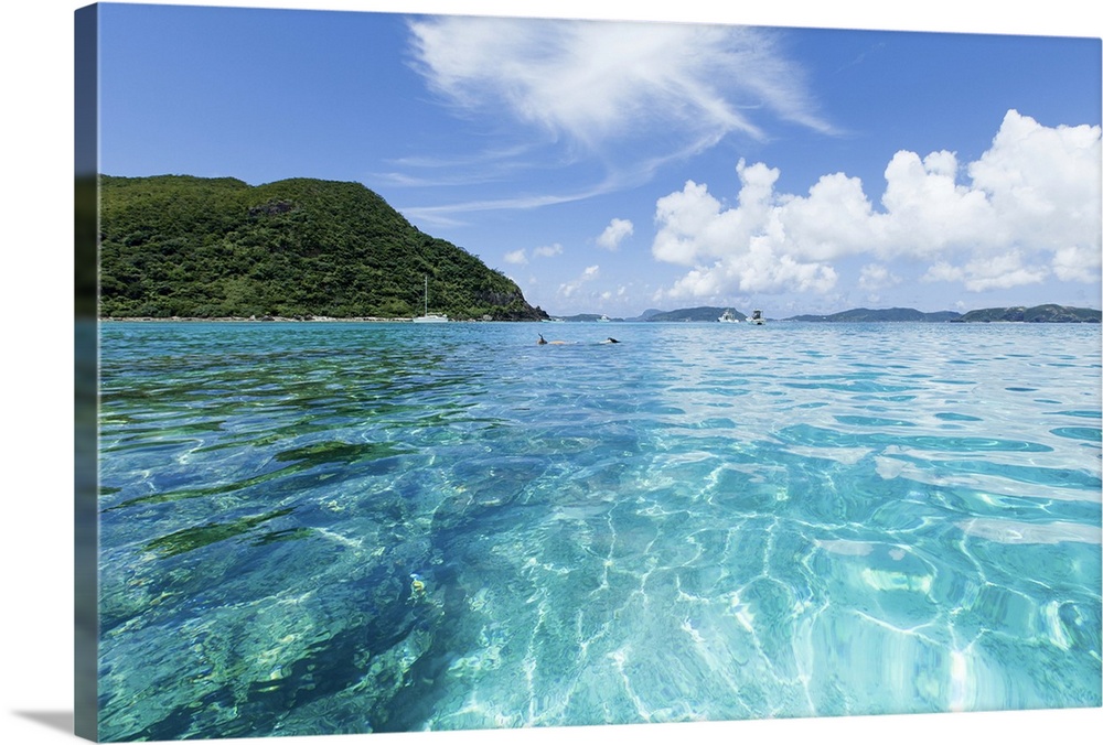 Crystal clear blue water over coral reef around tropical island, Tokashiki Island, of Kerama Islands, Okinawa, Japan.